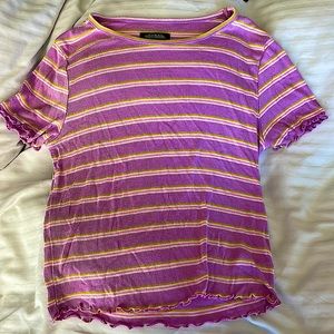 A stylish, multi color shirt, the size is a medium, the brand is Wild Fable.